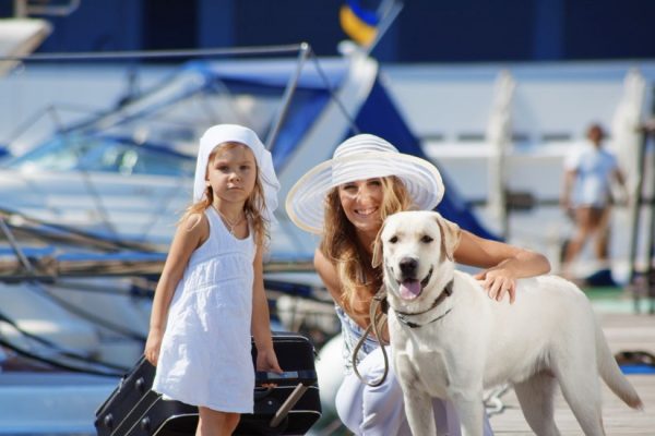 Mother, young daughter and pet dog on the move with mortgage services from Aetas Partners