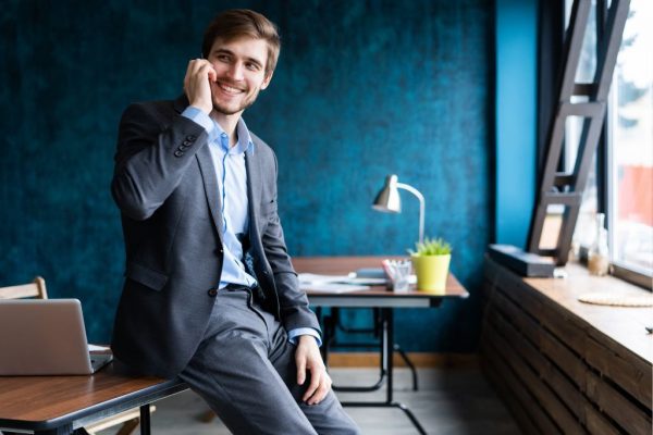 wealthy entrepreneur on the phone in his office doing business