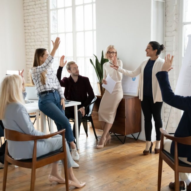 Motivated,Employees,Raising,Hands,,Asking,Coach,At,Training.,Presenter,Finishing Employee Benefits