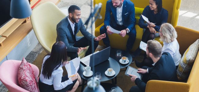 business professionals in a meeting about Aetas Connect