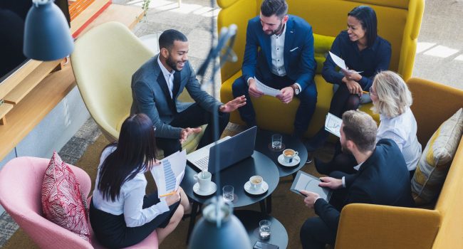 business professionals in a meeting about Aetas Connect