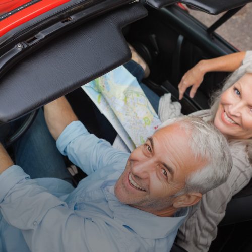 Spending some quality time together Older couple in convertible red car