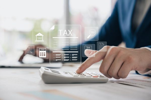 Corporate,And,Individual,Tax,Payment,Concept,,Businessman,Using,Computer,Filling